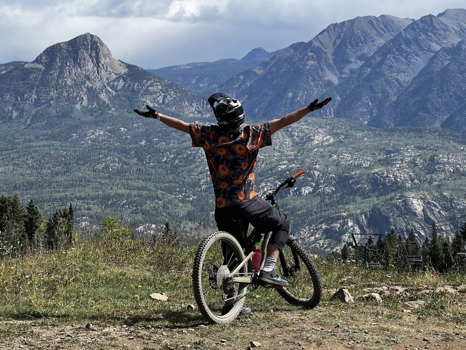 Grayson Geiger mountain biking on a Colorado summit